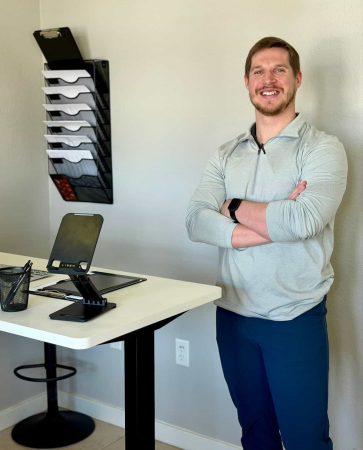 Dr. Cameron Williams standing in the Radiant Chiropractic office